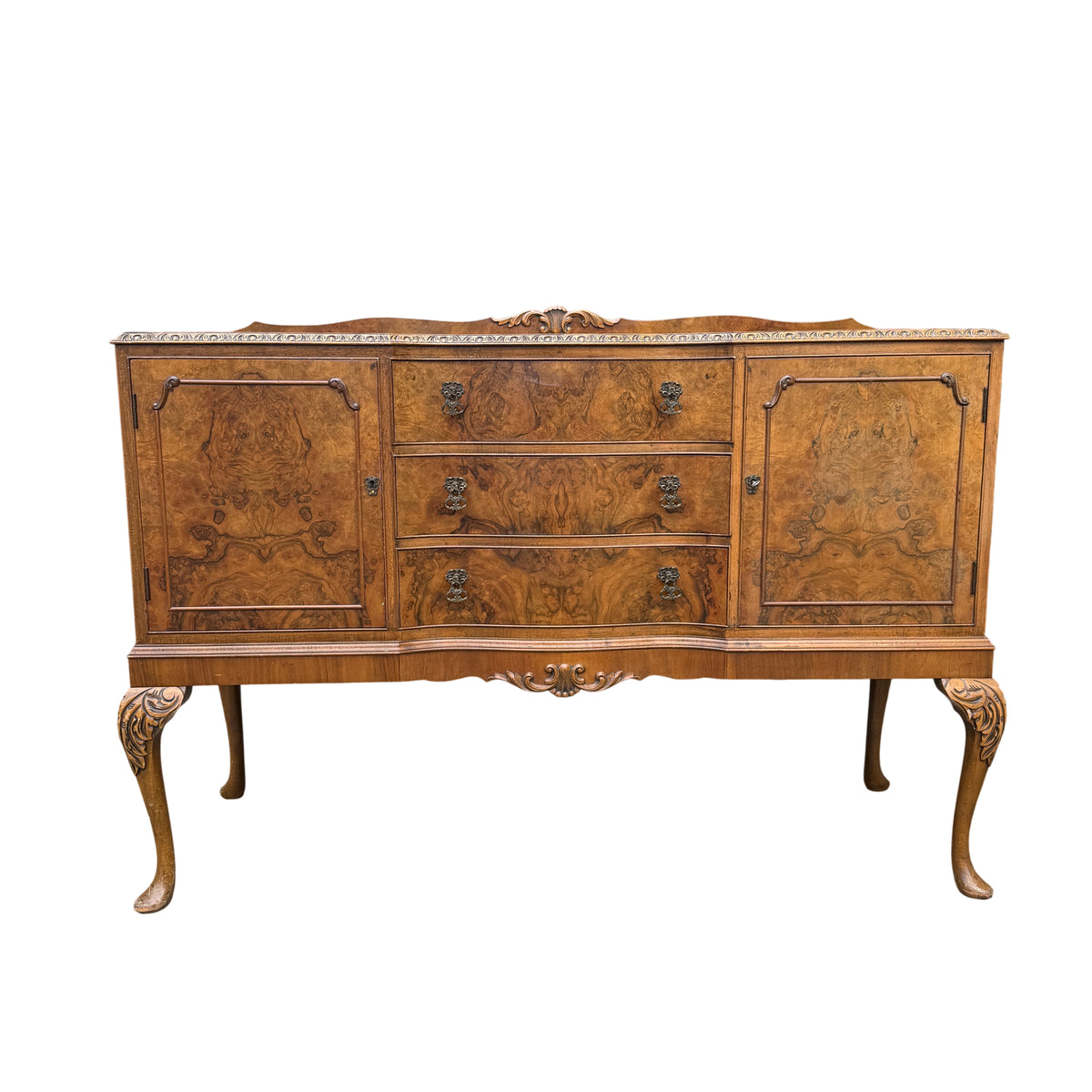 Front view burr walnut sideboard with burr veneer and decorative metal drop handles