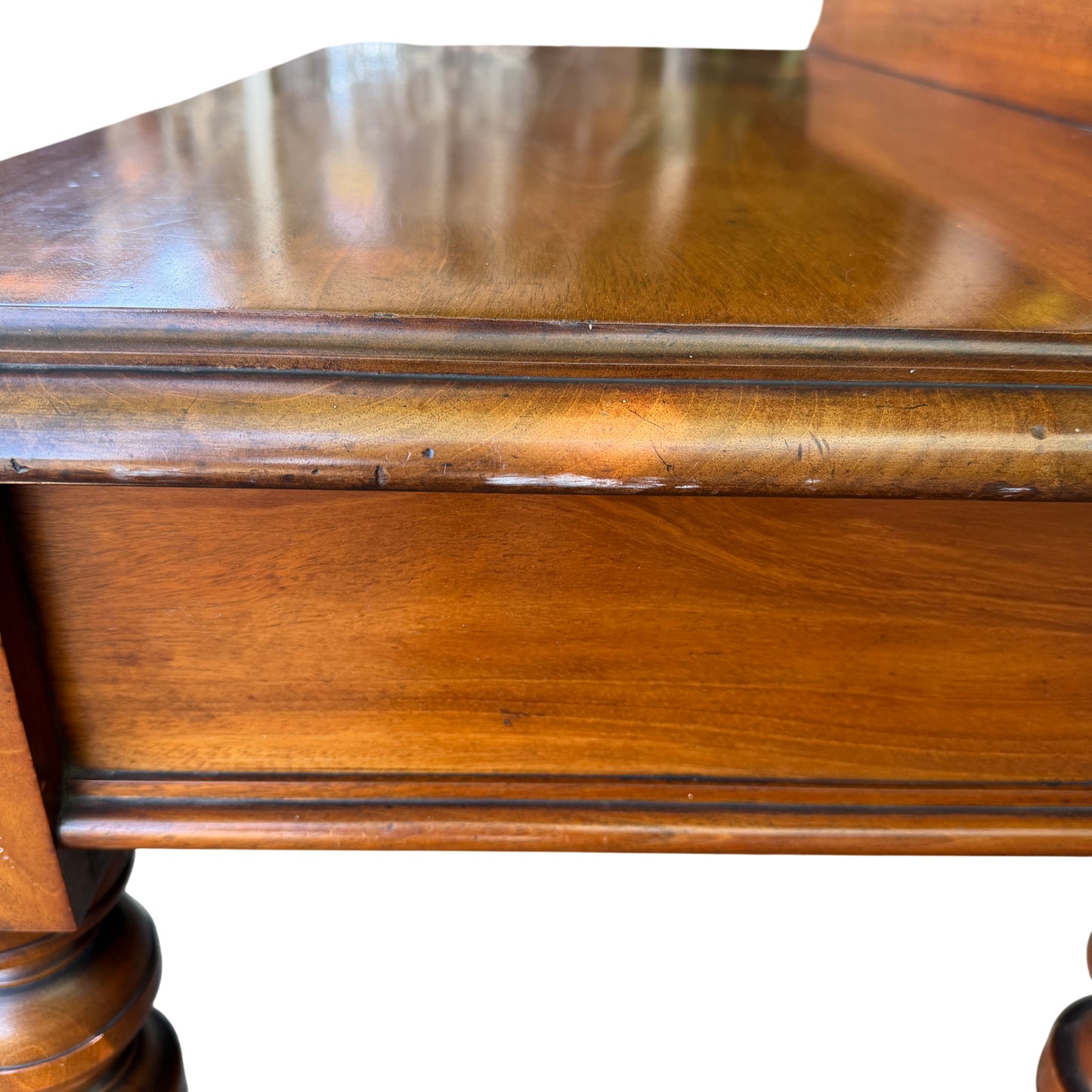 Detailed shot of drawer front and knob on vintage console table