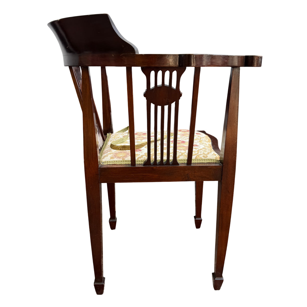 Worn finish and scuffs visible on the arm and crest rail of the chair