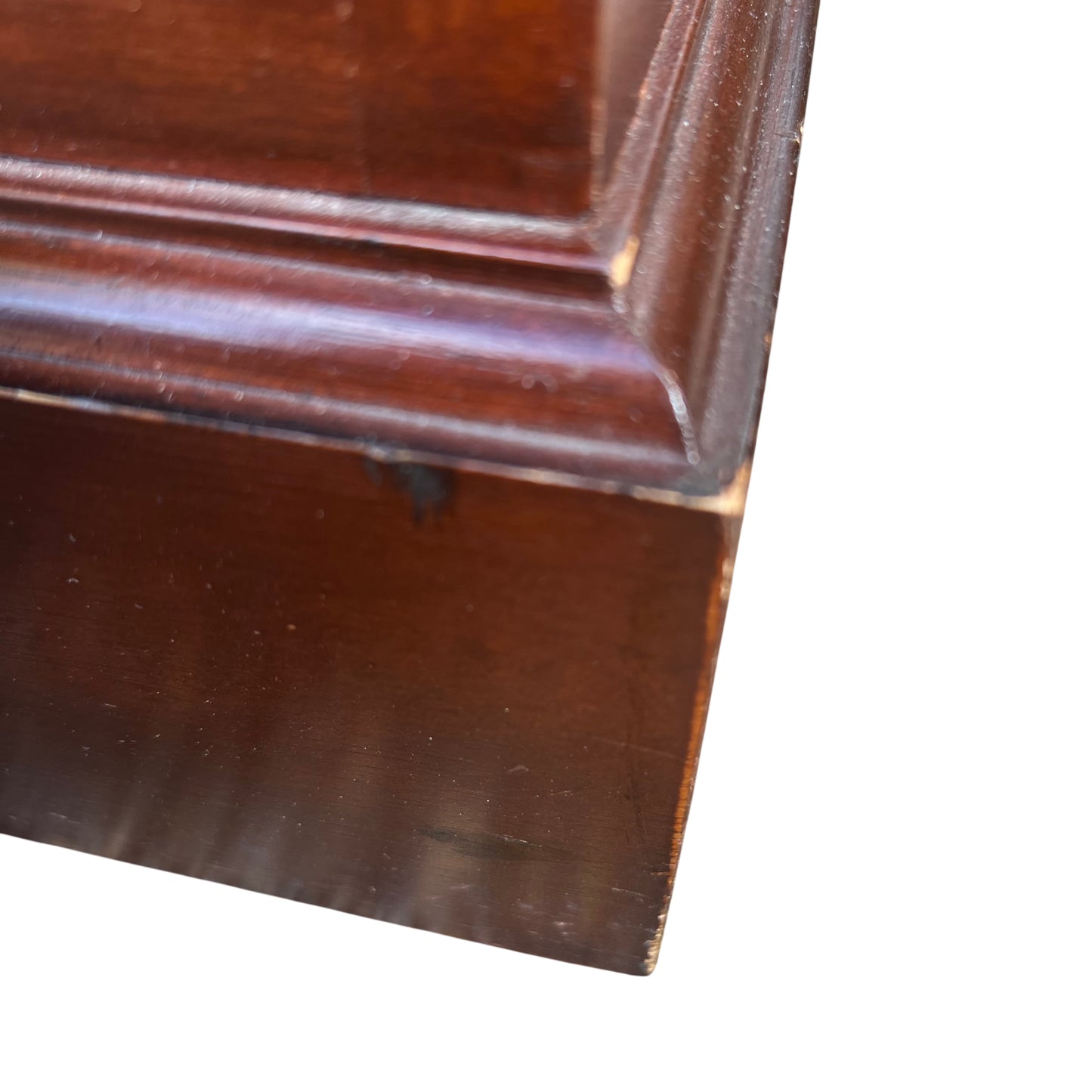 Overhead view of top surface on mahogany veneer bookcase showing grain