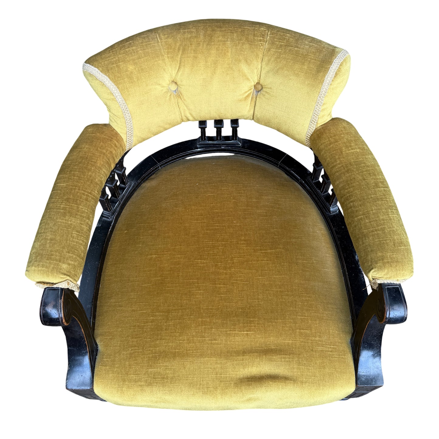 Side view ebonised armchair with rolled arms and turned front legs on ceramic castors