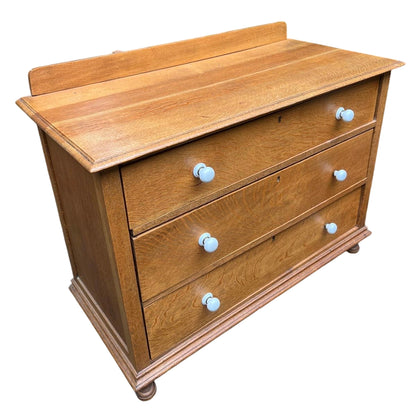 Top view showing moulded oak top and small upstand of a 3-drawer chest
