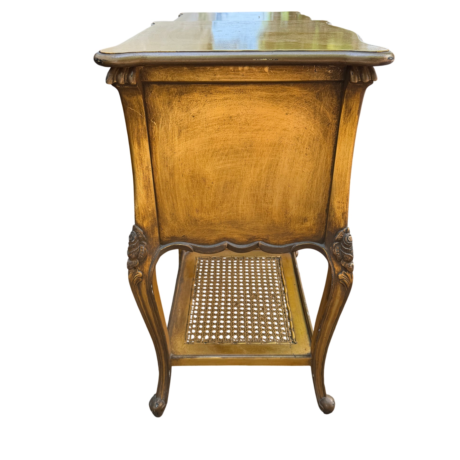 Close up of bedside cabinet drawer and decorative round knob in gold finish