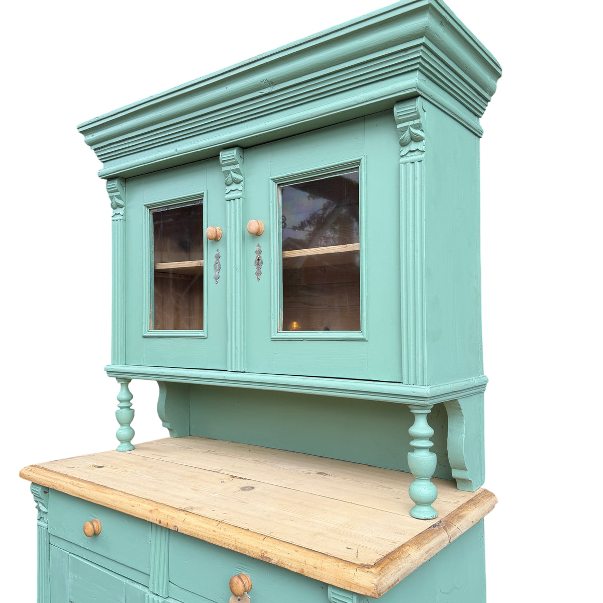Tall vintage painted pine cabinet showing glazed panels and decorative moulding