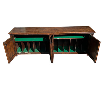 Side view of carved oak sideboard showing moulded edge and leg detail