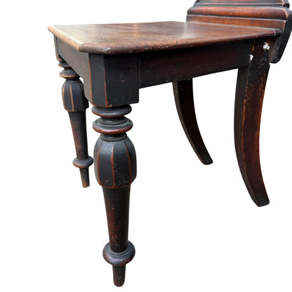 Rear seat split visible on solid wood seat of Victorian chair