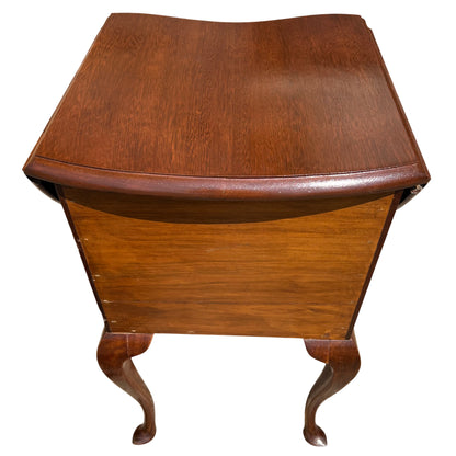 Open drawers on vintage bedside cabinet revealing interior timber