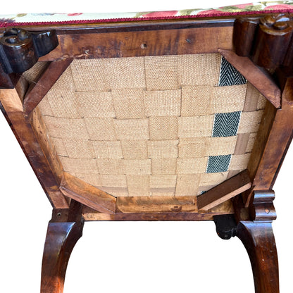 Close-up of carved mahogany leg and claw-and-ball foot on vintage stool