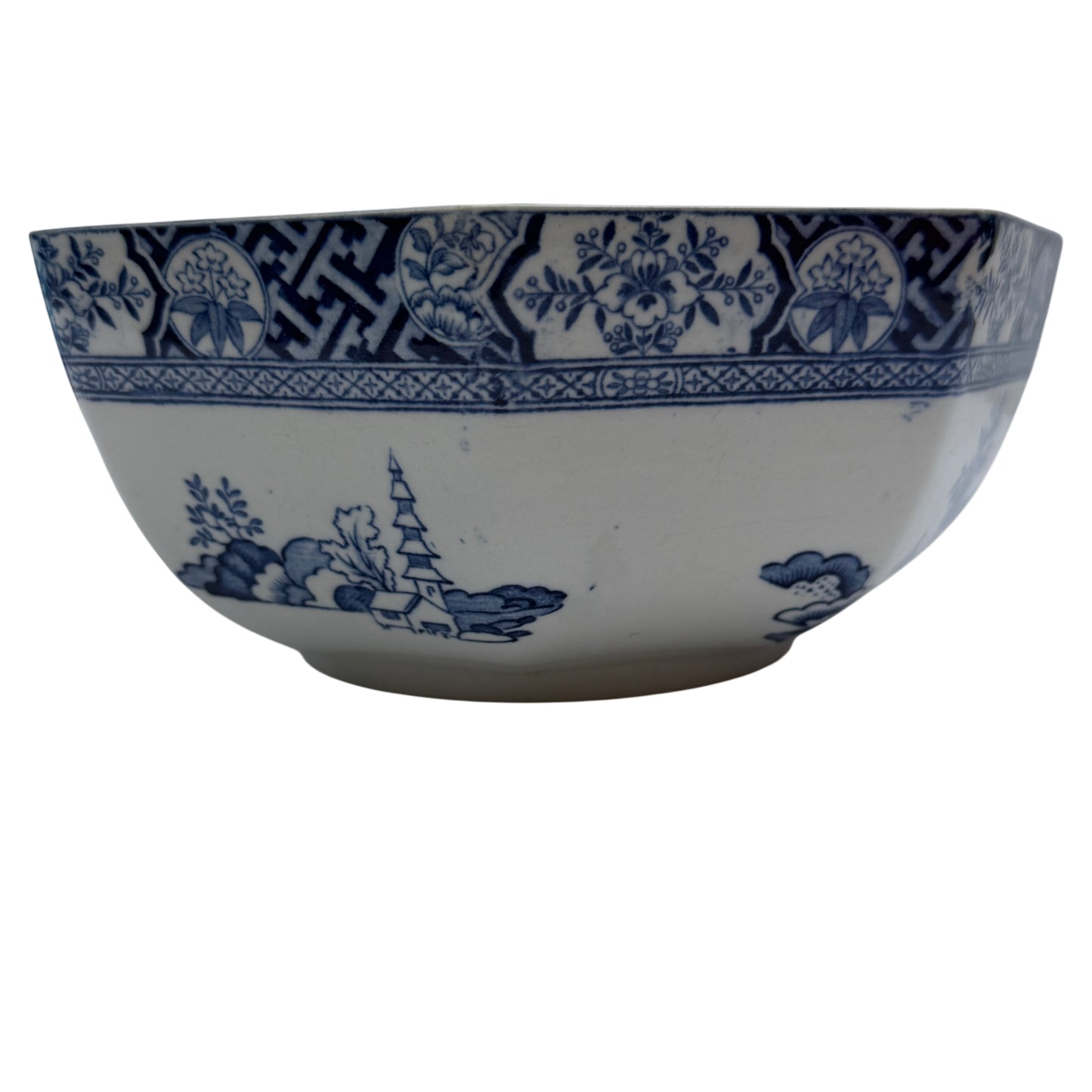 Top-down view of octagonal English transferware serving bowl with decorative panels