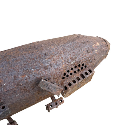 Riveted pressed-steel hull of vintage Zeppelin model showing rivet rows and curved panels
