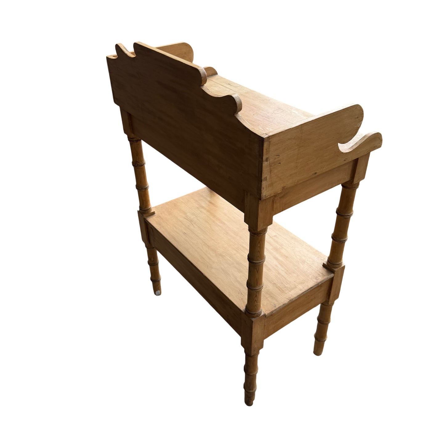 Top surface of pine bedside cabinet showing plank grain and joins