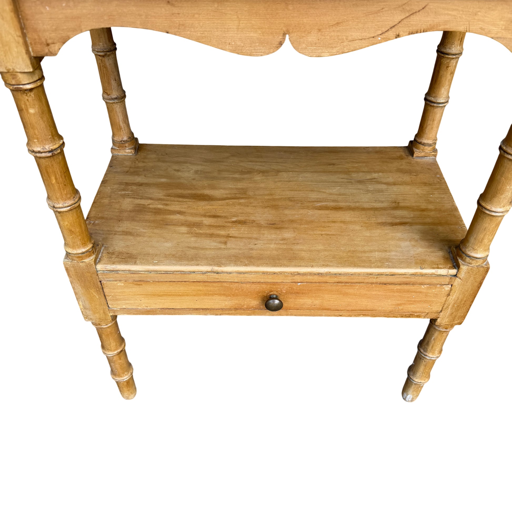 Turned leg detail on pine bedside cabinet showing spindle style supports
