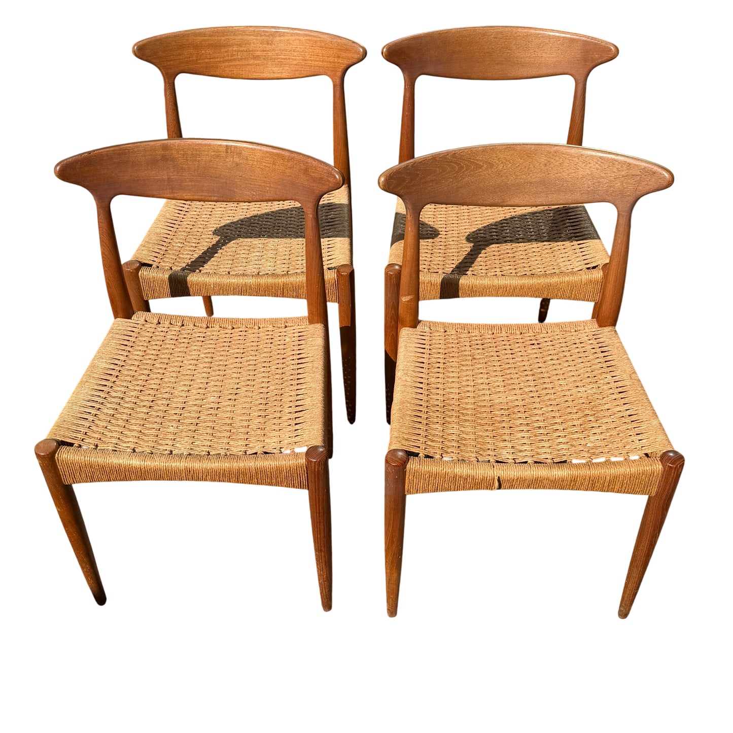 Close up of teak chair backrest with smooth curved profile and grain detail