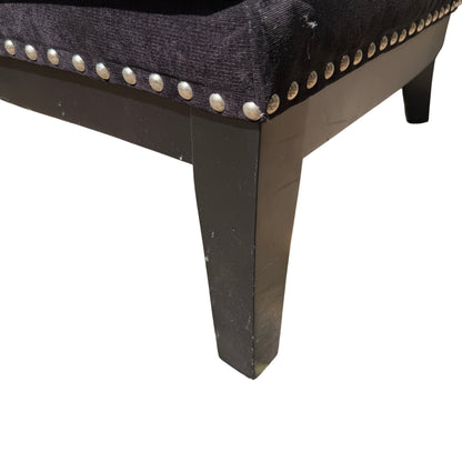 Close-up of removable seat cushion and seam detailing on upholstered armchair