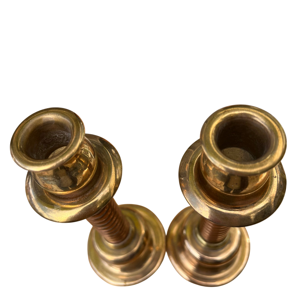 Base and lower section of vintage brass candlestick with turned profile and patina