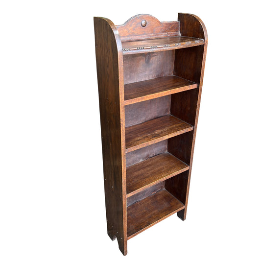 Tall narrow Arts & Crafts oak bookcase with moulded bead detail and four fixed shelves