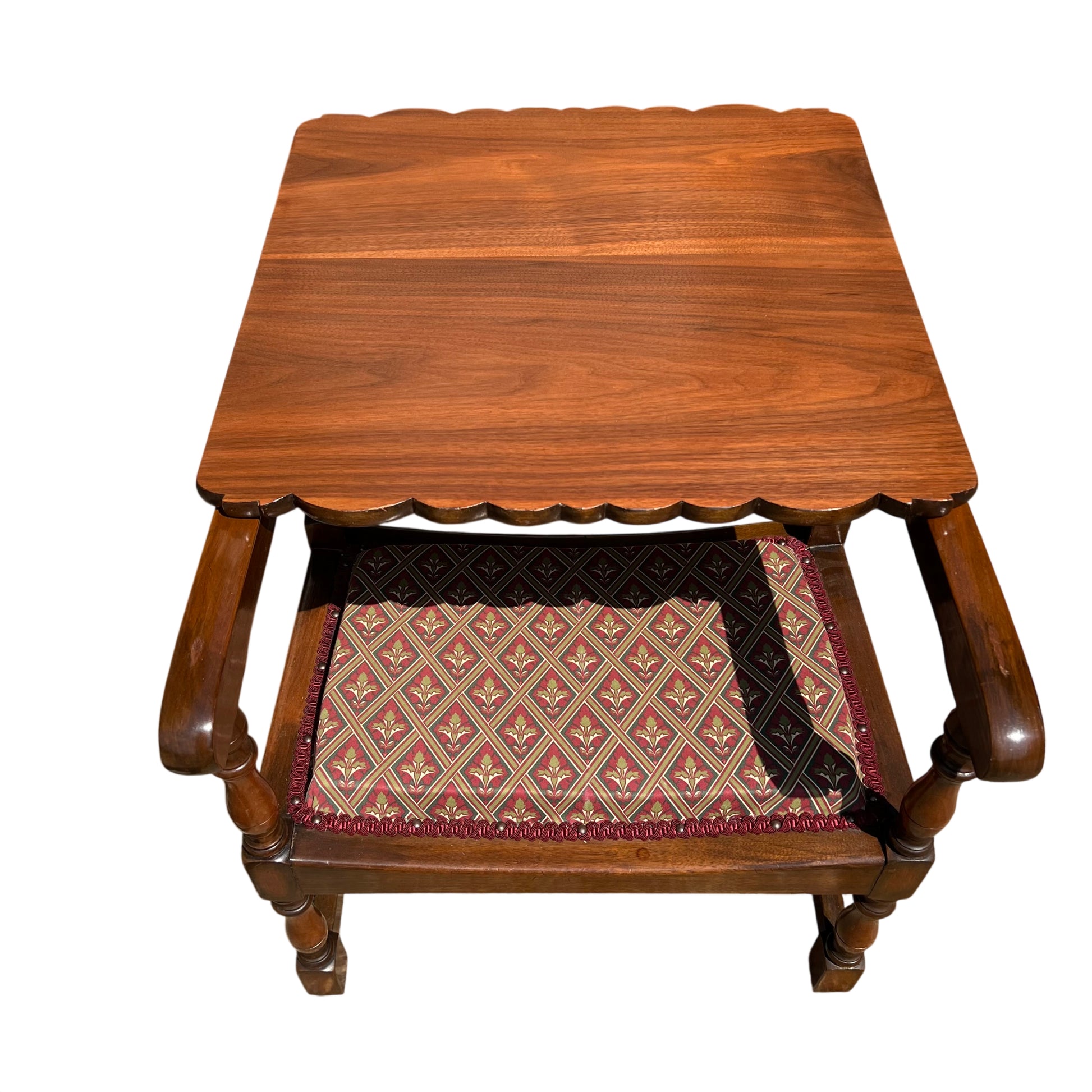 Patterned upholstered seat on vintage wooden armchair with rope trim