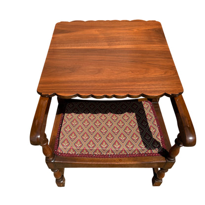 Patterned upholstered seat on vintage wooden armchair with rope trim