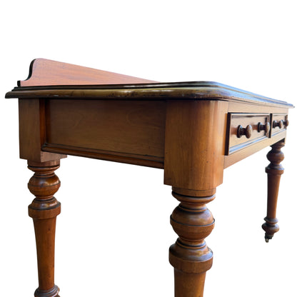 Under-table view showing kneehole and turned supports on Victorian console