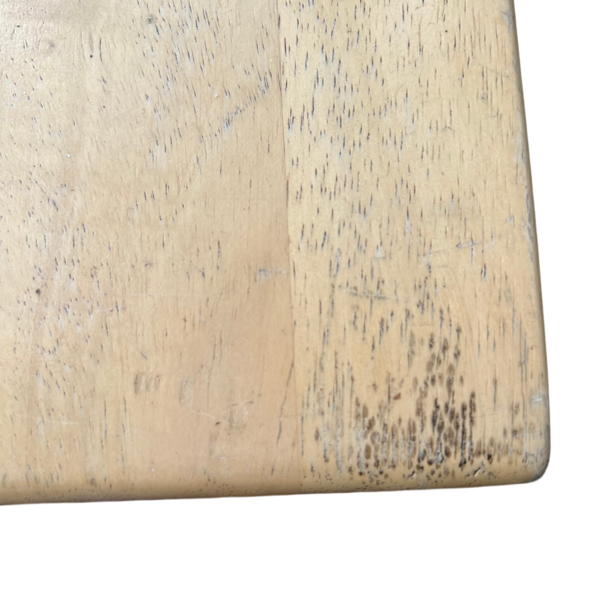 Close-up of stool legs and cross stretcher in a light wood finish