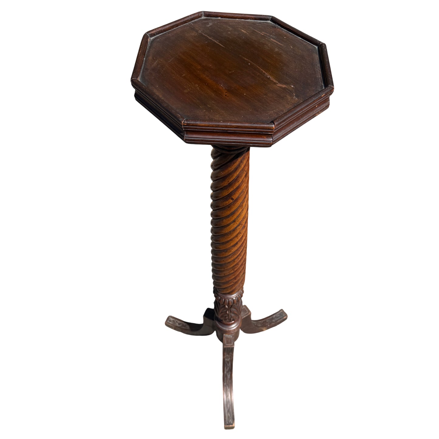 Side view showing column shadow and splayed feet of the pedestal stand