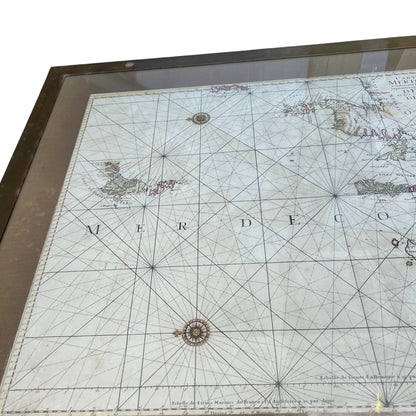 Top-down view of inset map displayed under glass on oak coffee table