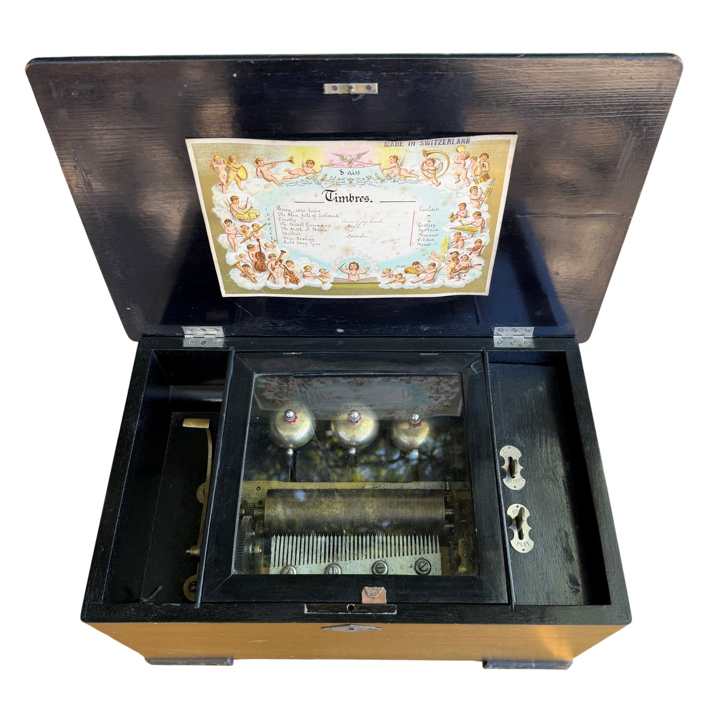 Open Victorian Swiss cylinder music box showing pinned brass cylinder and steel comb