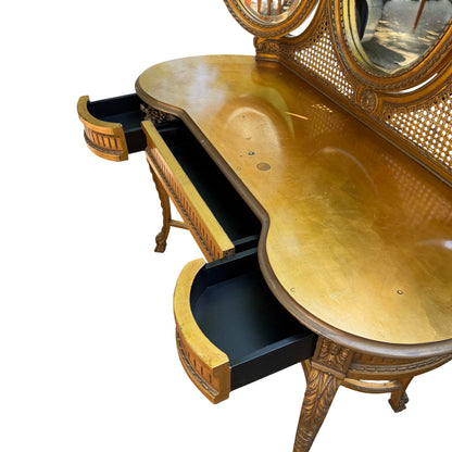 Ornate reproduction dressing table with oval mirrors and carved detail