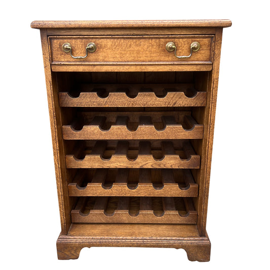 Oak wine rack cabinet with single drawer and brass handles Arts & Crafts style