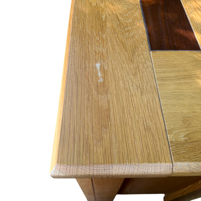 Pair of large oak bedside cabinets positioned side by side on concrete