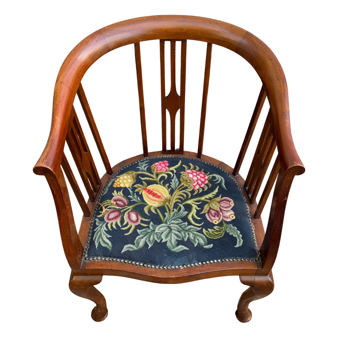 Side view of stained hardwood tub armchair showing shaped arm and slatted back