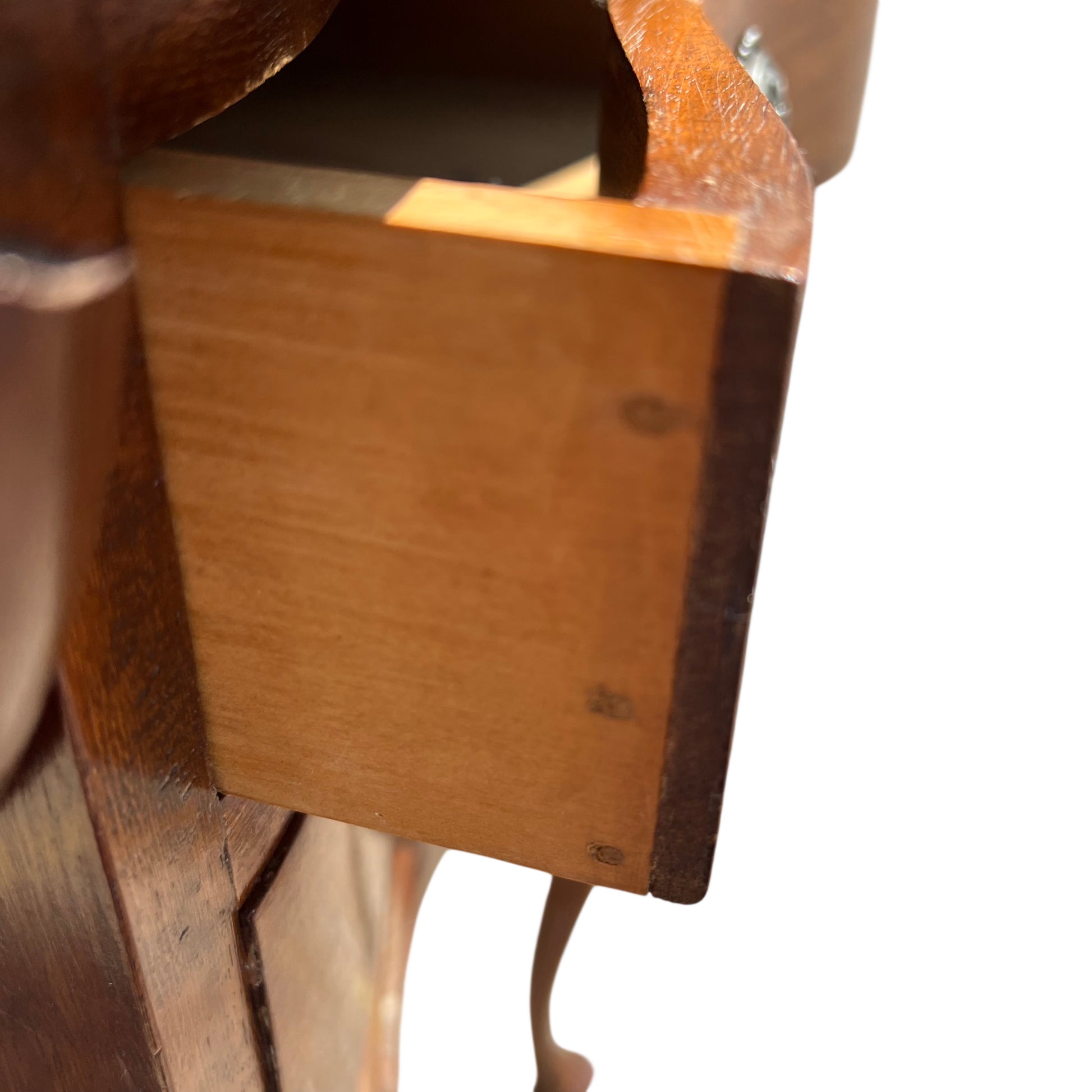 Front view of three-drawer bedside chest with curved drawer fronts