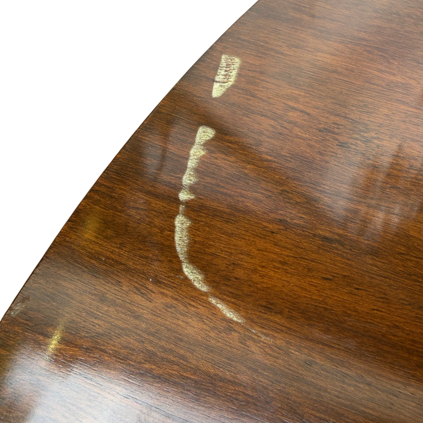 Edge of round dining table showing removable top and small scuffs