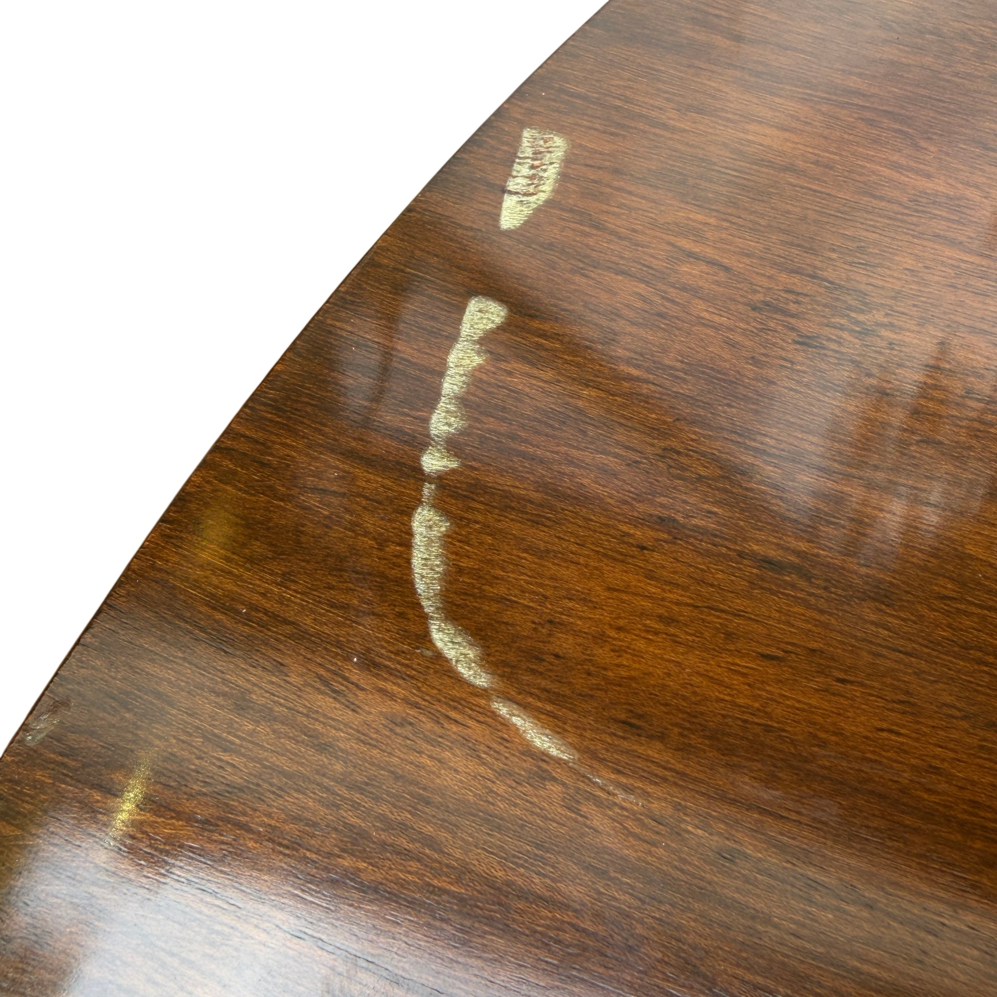 Edge of round dining table showing removable top and small scuffs