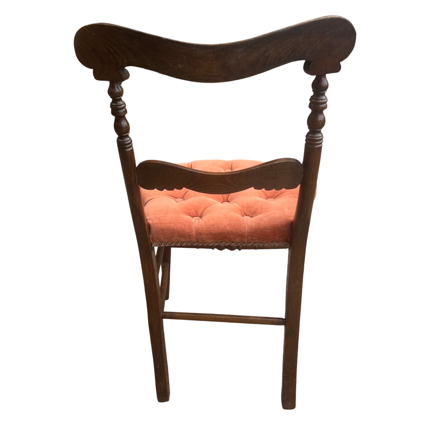 Buttoned orange upholstered seat pad on a Victorian hardwood dining chair