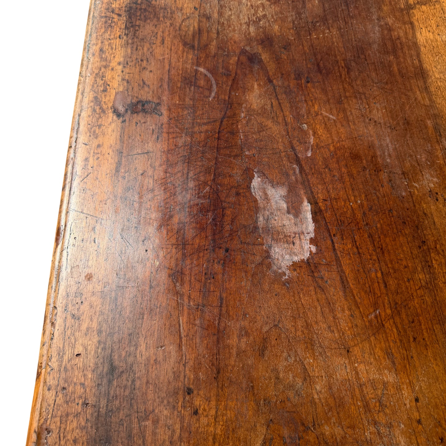Low oak coffee table with stretcher base photographed on pavement