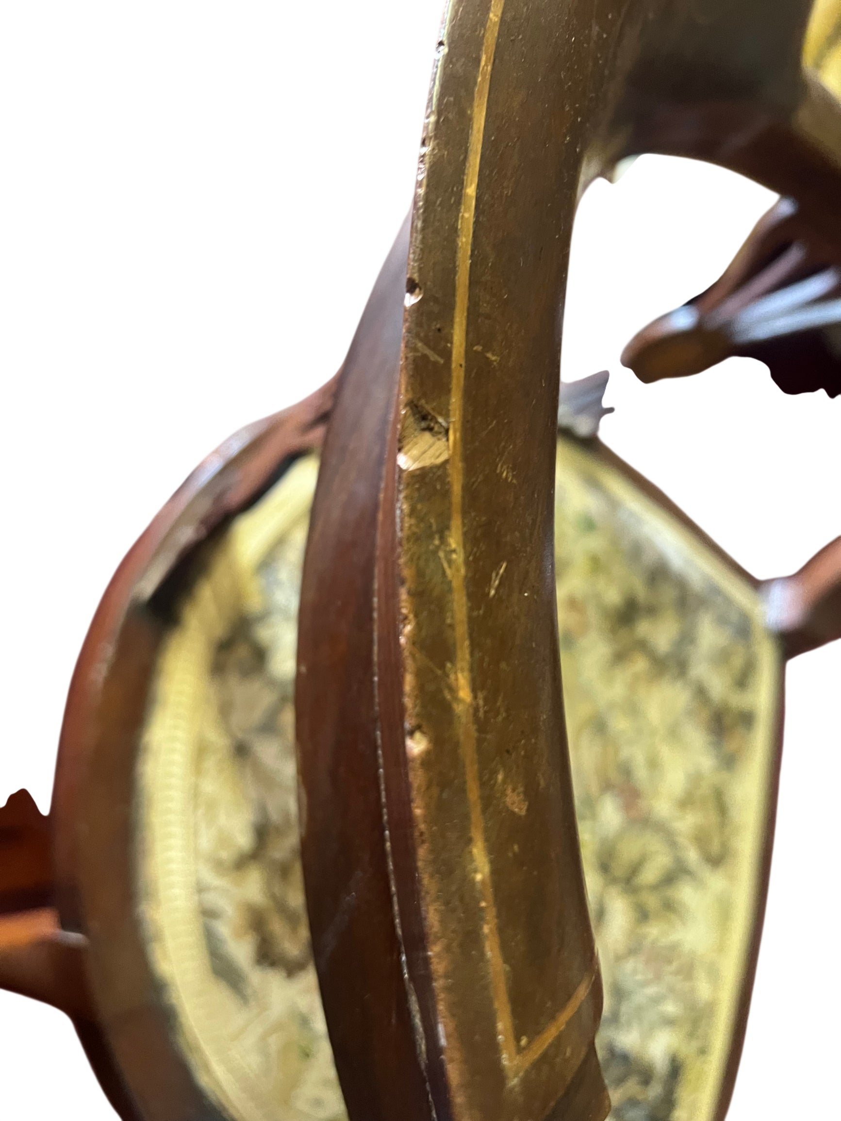 Close up of tapestry seat pattern on antique armchair