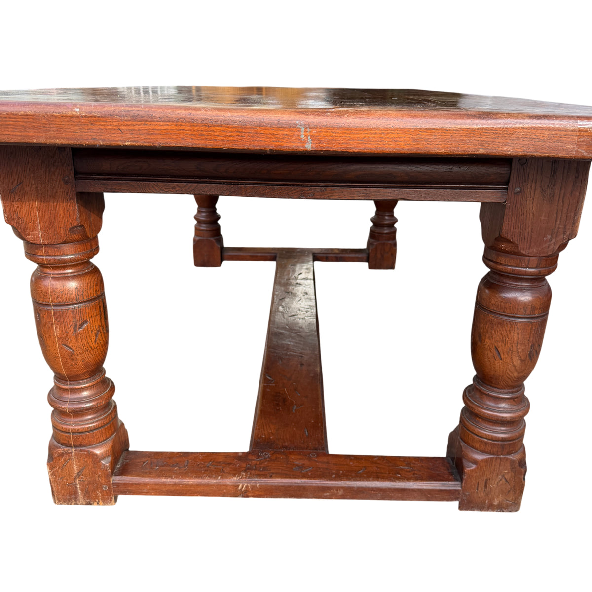 Underside view showing central H-stretcher connecting pedestal bases