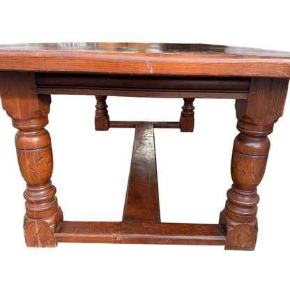 Underside view showing central H-stretcher connecting pedestal bases