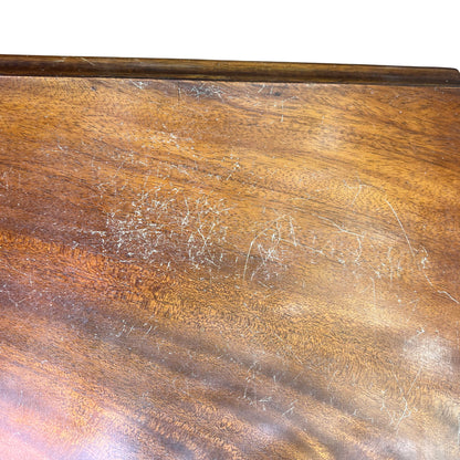 Detail of drawer fronts showing mahogany veneer grain and patina