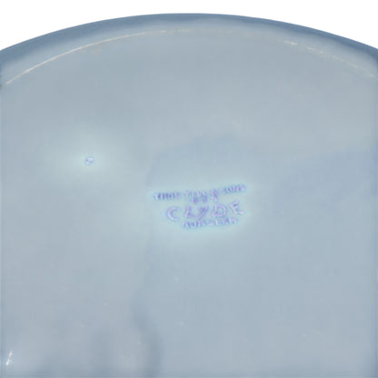 Side perspective of blue and white Clyde pattern plate showing shallow dish profile