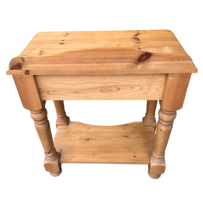 Close-up of drawer front and knob on pine hall table