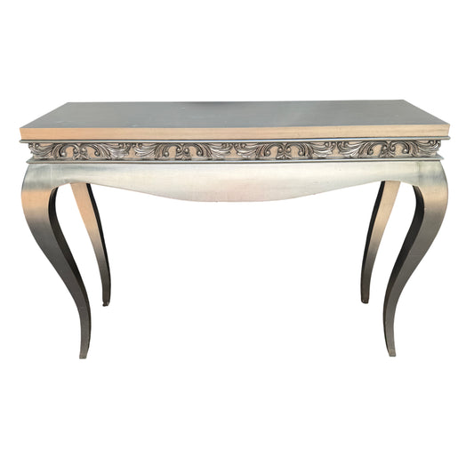 Silver painted console table with ornate carved frieze and narrow footprint for hallway