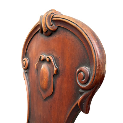 Detail of raised central cartouche on shield back of chair