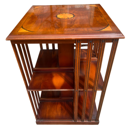 Rotating bookcase with central column and multiple shelves in mahogany veneer