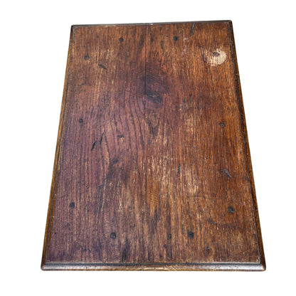 Antique-style oak side table with warm brown finish and patina