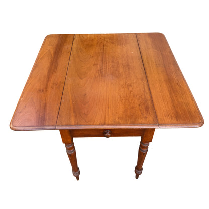 Drop-leaf table with one drawer under the apron and turned spindle legs