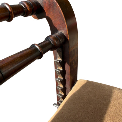 Top-down view of adjustable seat and turned spindle arm supports