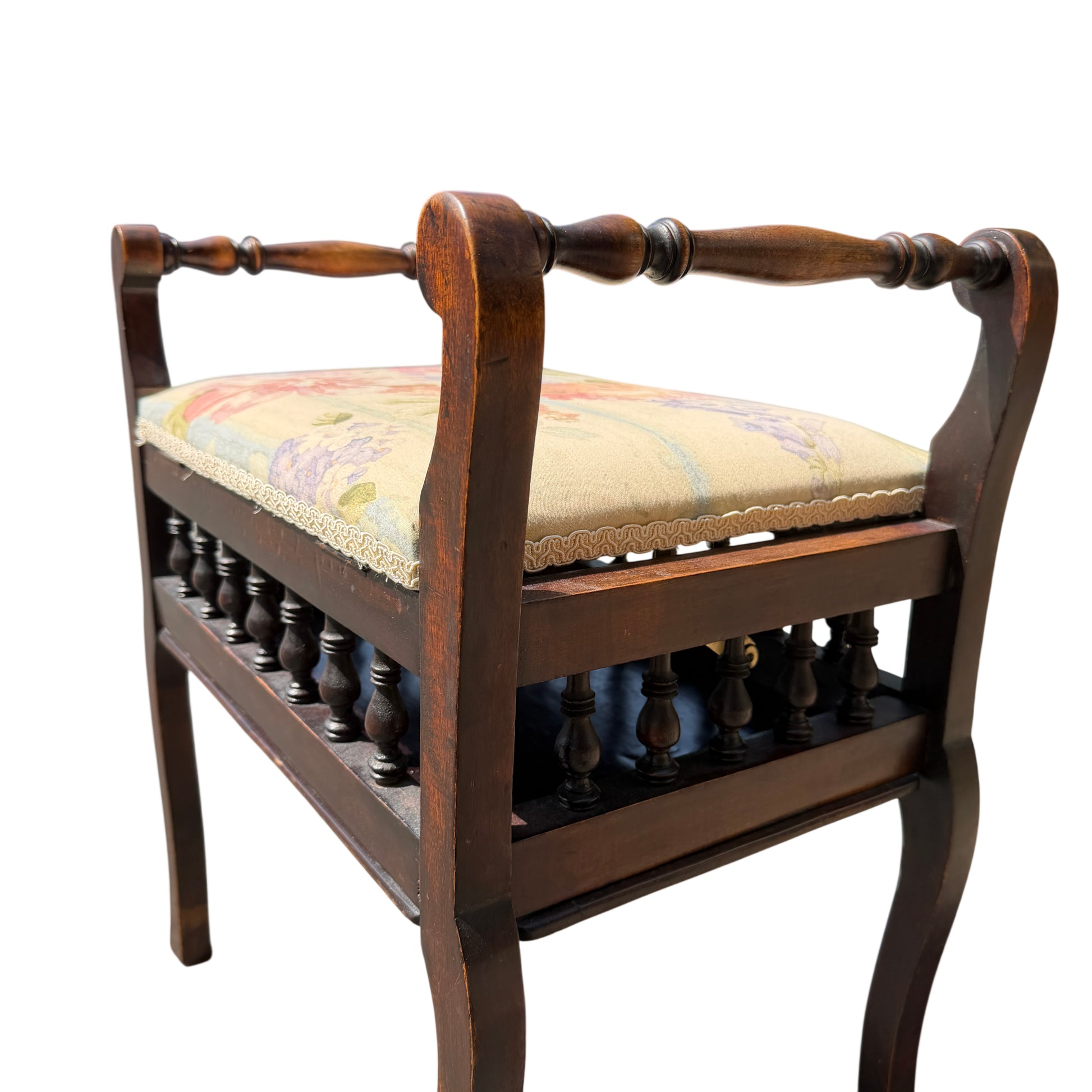 Side view of small Victorian stool with shaped legs and dark wood finish