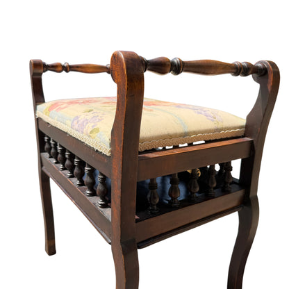 Side view of small Victorian stool with shaped legs and dark wood finish